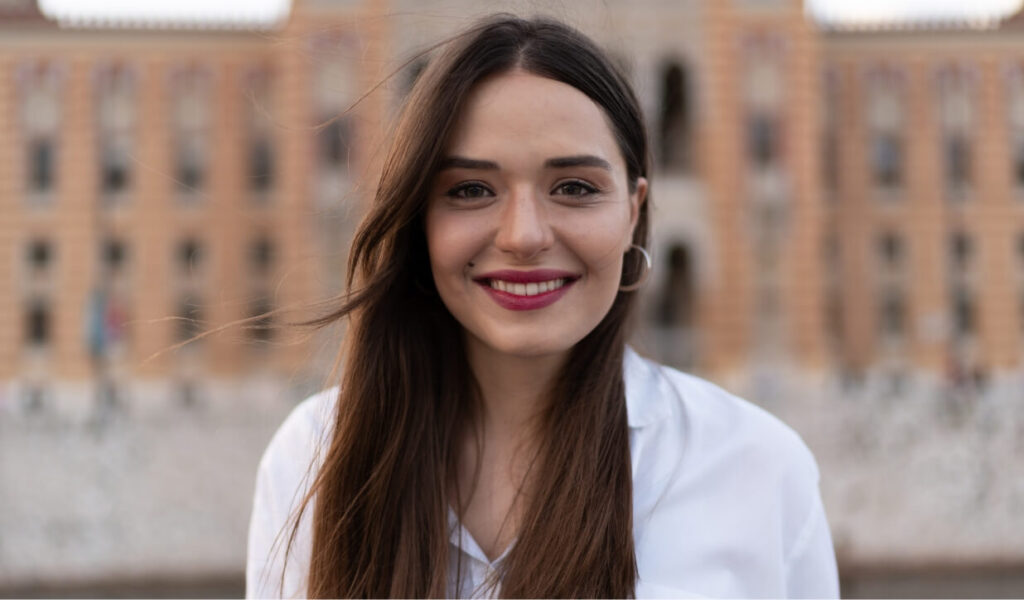 portrait-of-young-woman-in-front-of-the-library-2023-11-27-04-56-49-utc (1)