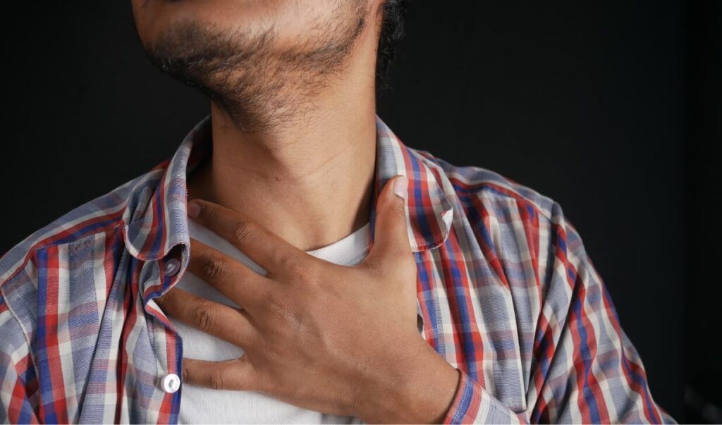unrecognized-man-suffering-throat-pain-close-up-2023-11-27-05-05-38-utc (1)